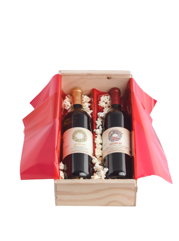 wood crate with christmas red and white wines red wrap